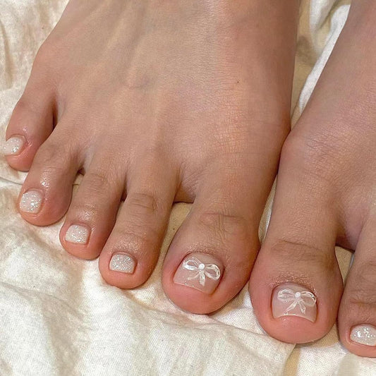 24 Stück 3D Bowknot Falsche Zehennägel, Nude Rosa Französische Kurze Künstliche Fußnägel, Natürliche Glitzer Acryl Zehennägel zum Aufkleben Quadratische für Frauen und Mädchen Nagelkunst DIY